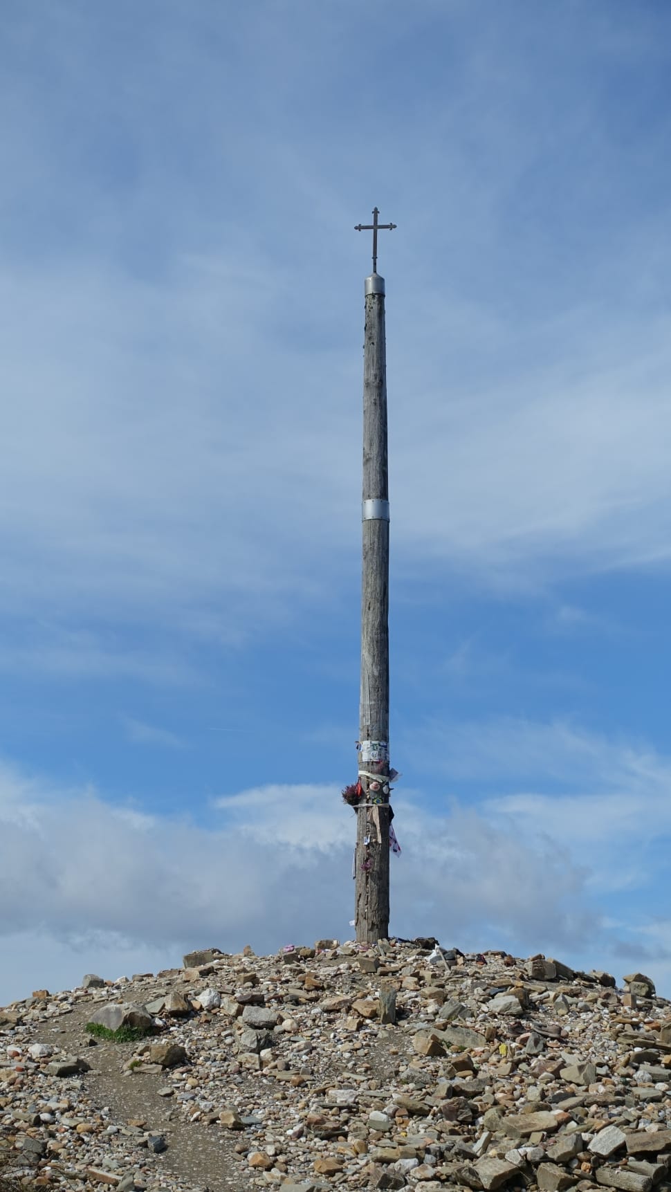 gray wooden post and cross symbol on top preview