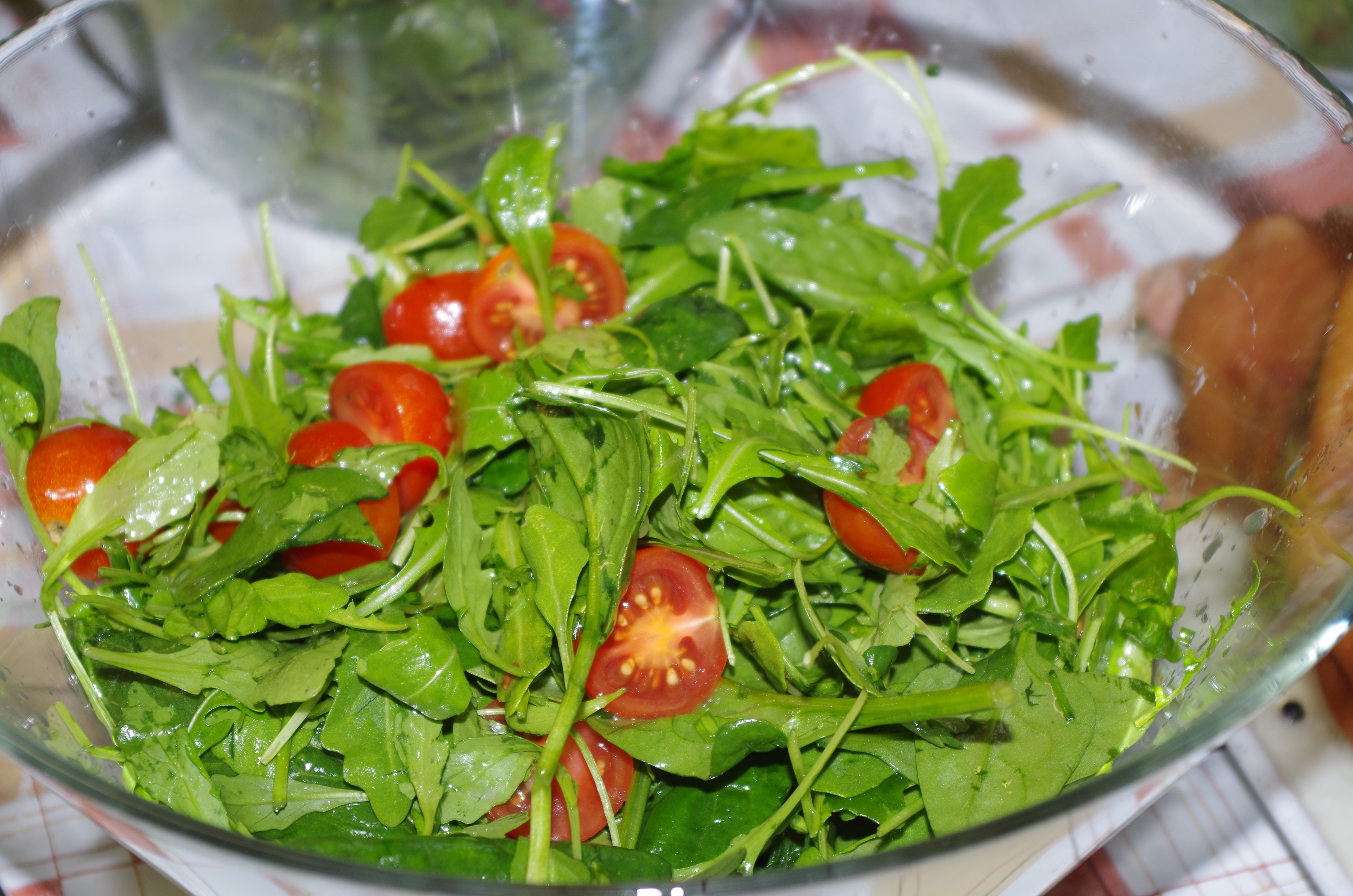 green leafy vegetables and red slice tomato salad