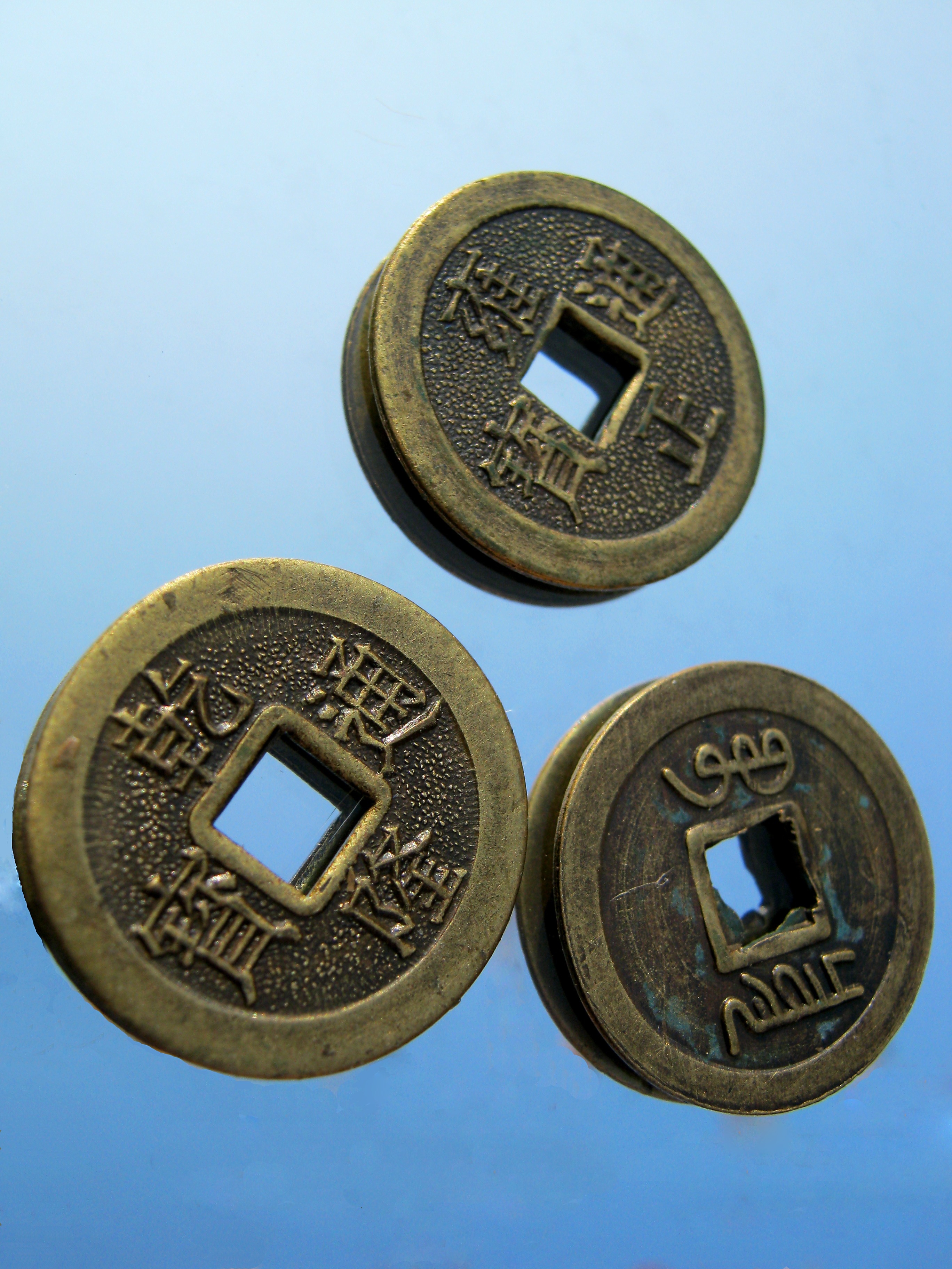 3 brass round coins