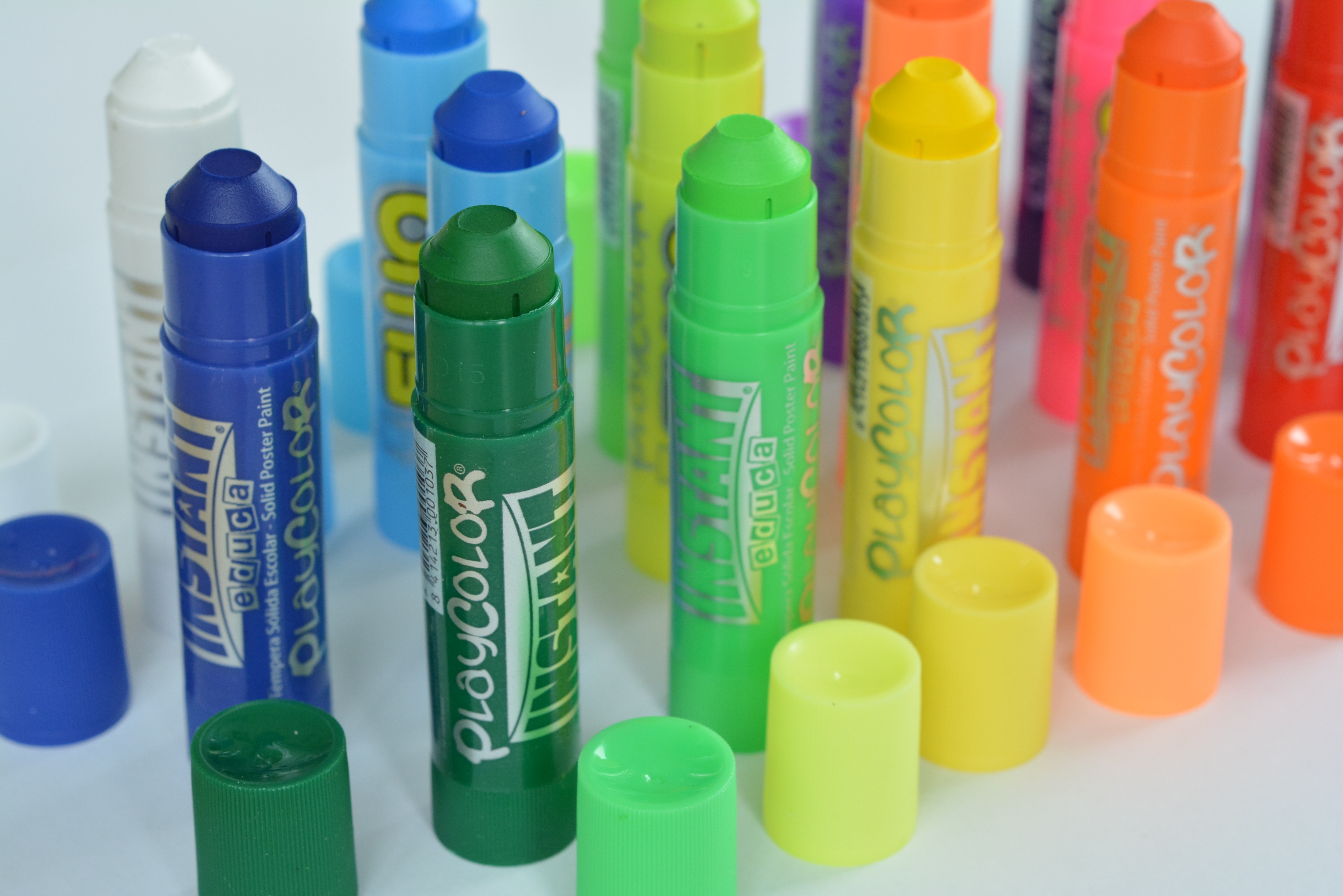 green blue yellow labeled plastic tube lot