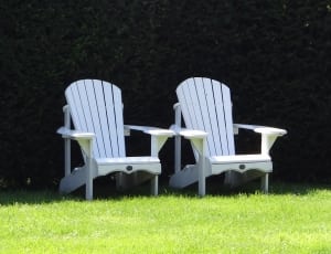 2 white wooden lounge chairs thumbnail