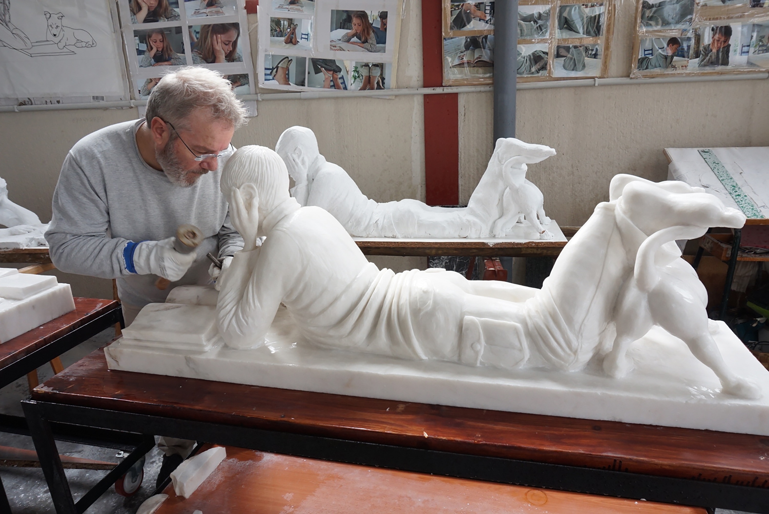 white ceramic man laying down statuette