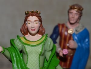 green blue and brown king and queen ceramic figurines thumbnail