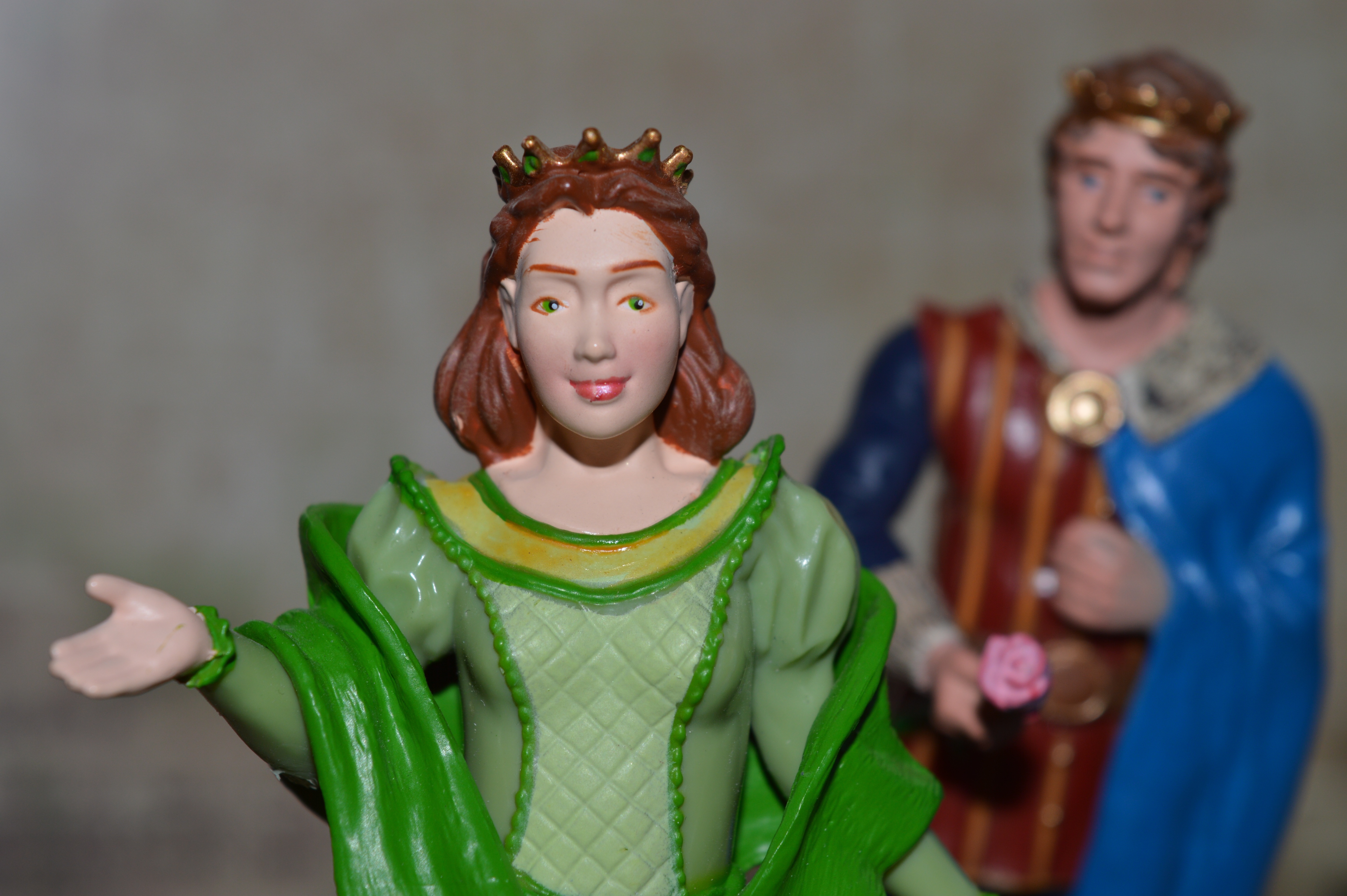 green blue and brown king and queen ceramic figurines