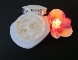 white ceramic container with cream thumbnail