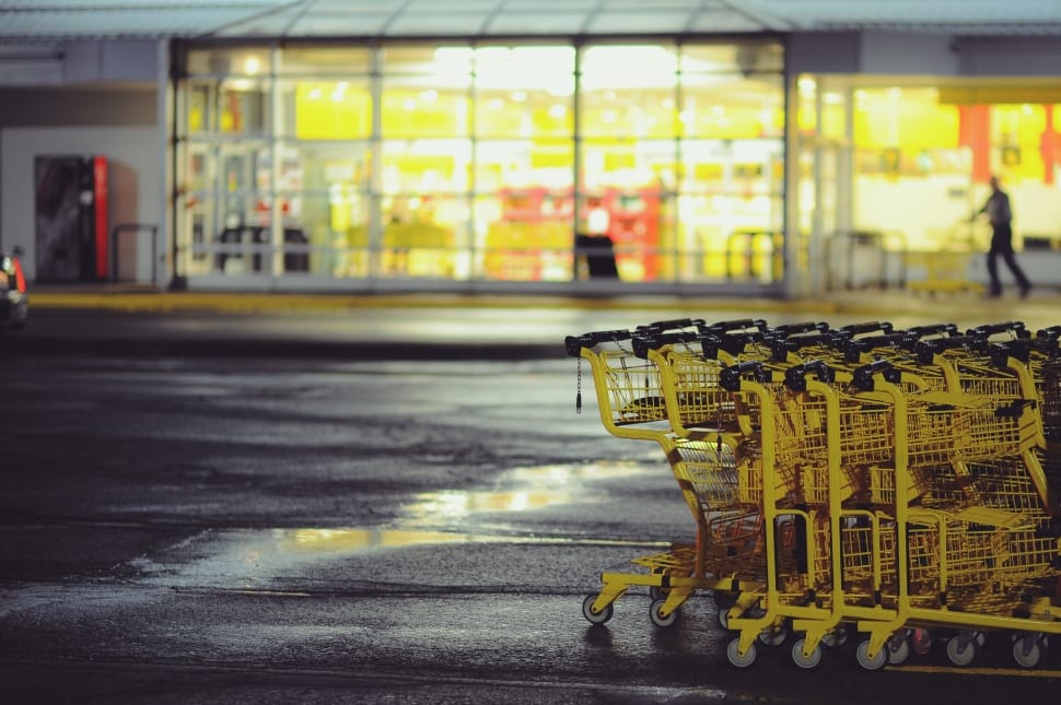 yellow steel shopping cards near grocery store in shallow focus photography preview