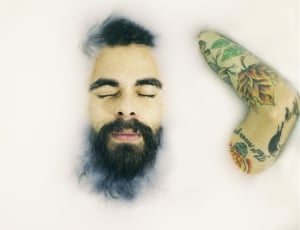 man with beard and arm tattoo thumbnail