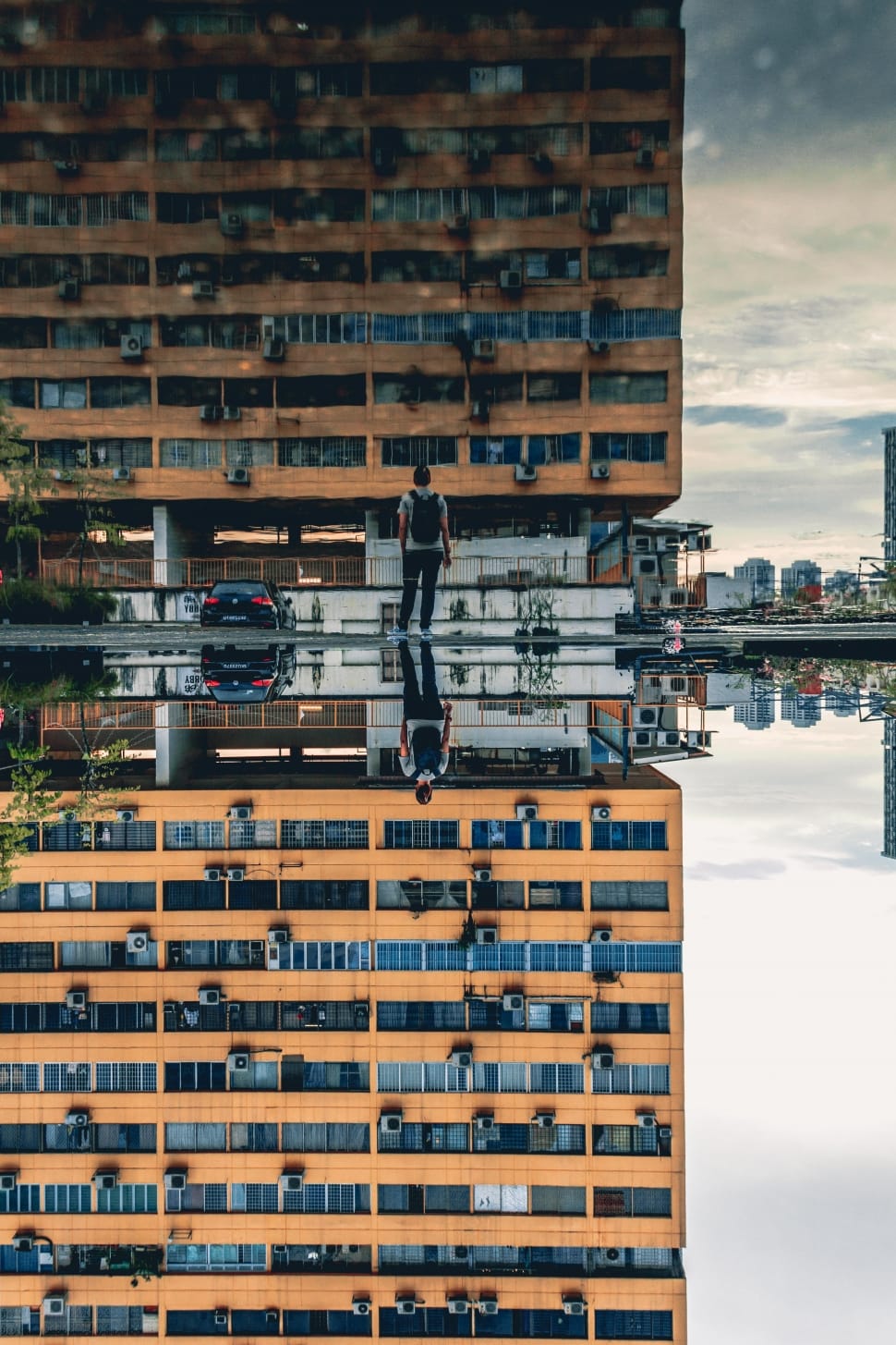 photo reflection of man and building during daytime photography preview