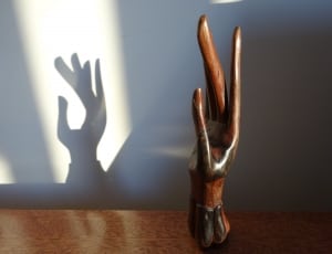 brown wooden hand table decor thumbnail