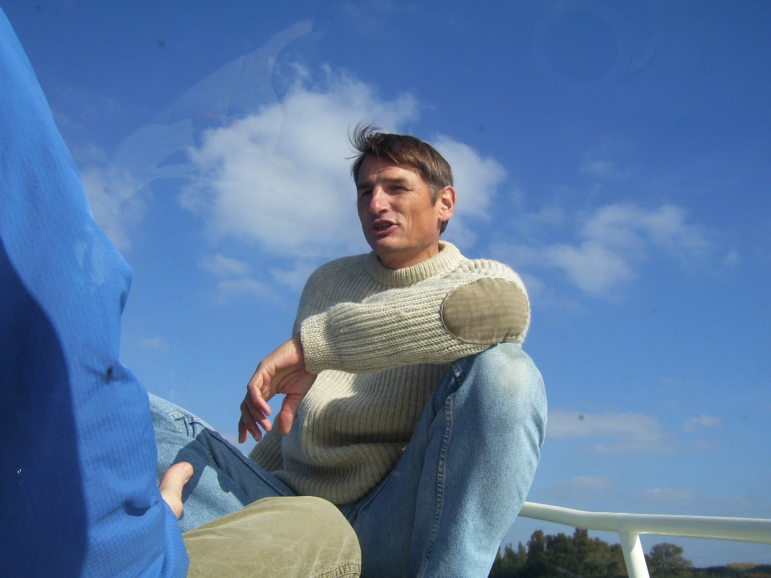 men's gray cashmere sweater and blue jeans