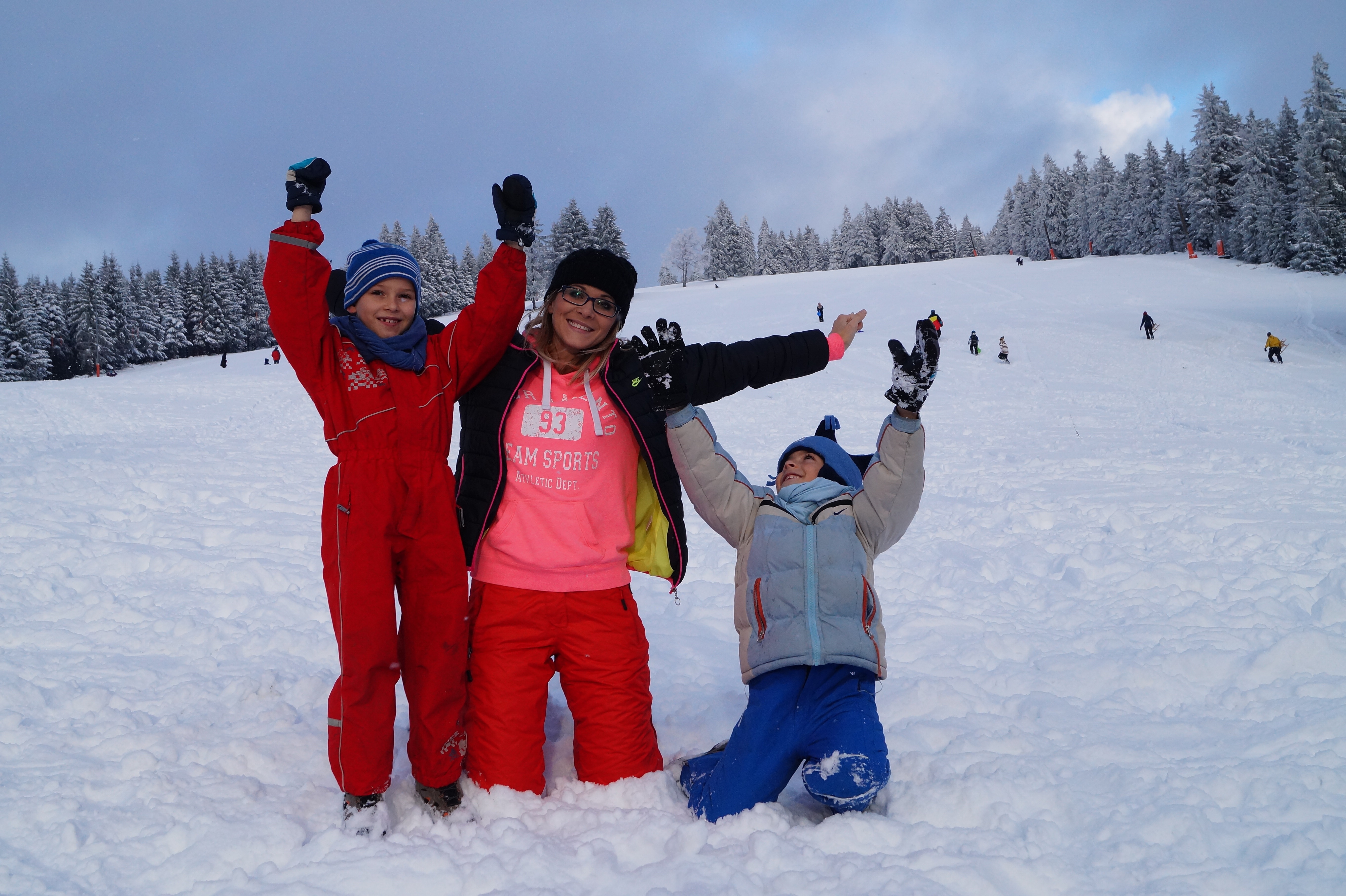 3 person on snow field