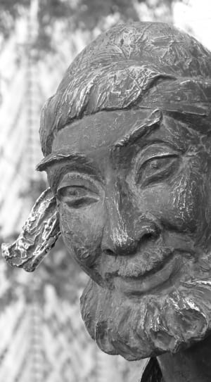 black and white wooden human head figurine thumbnail