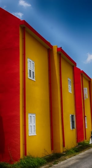 yellow and red painted building thumbnail