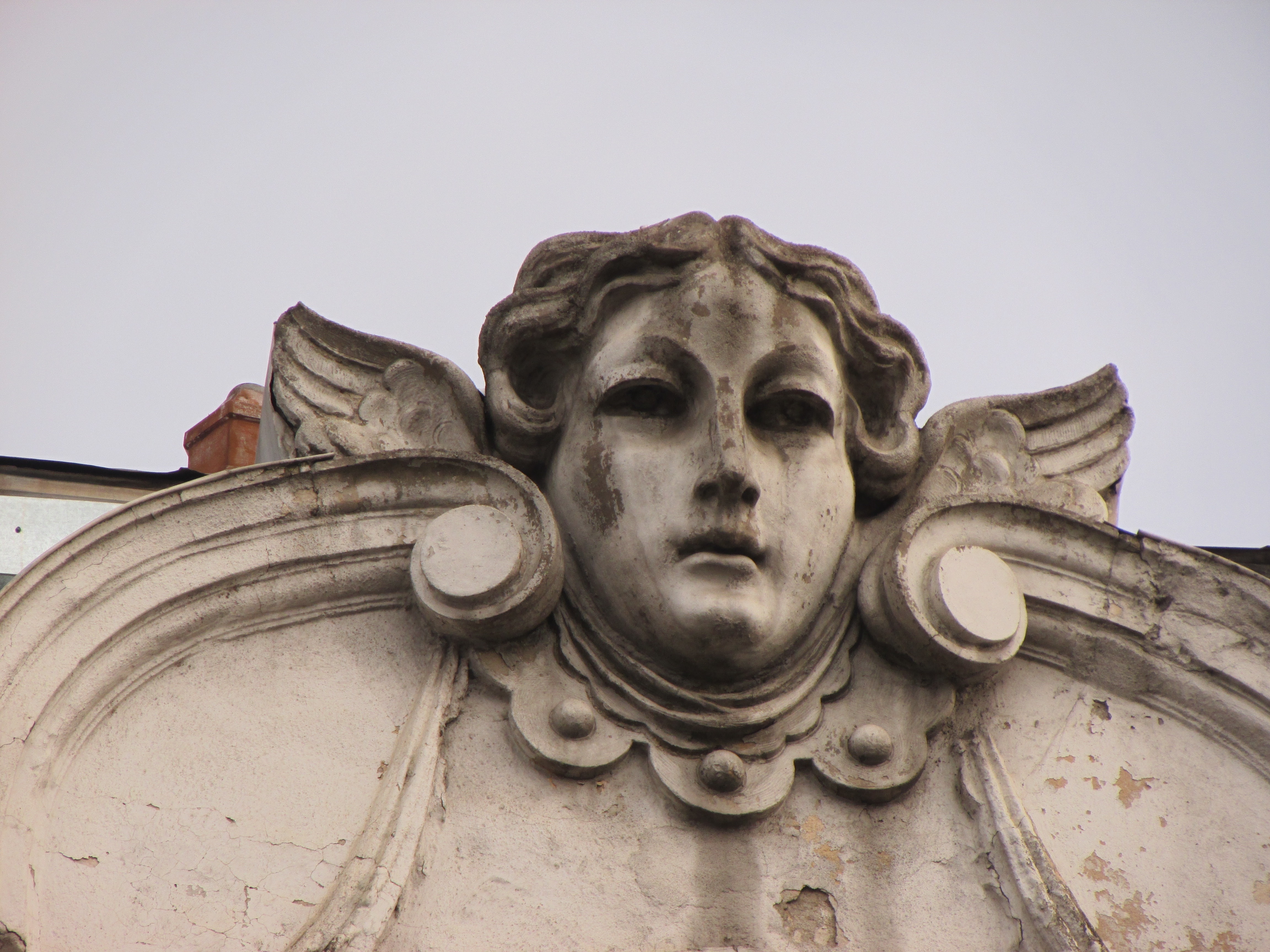 gray concrete angel head bust