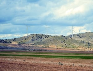 photography of windmills on mountain thumbnail