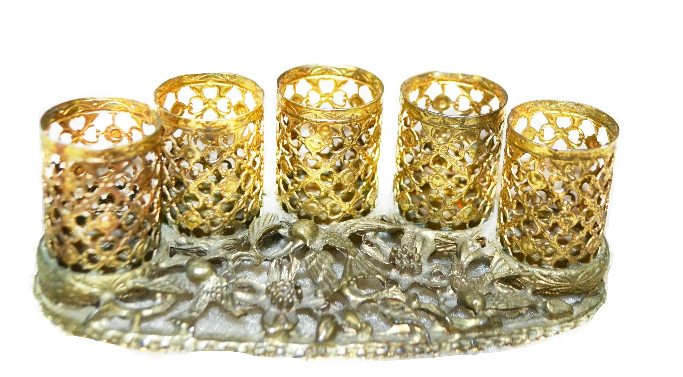 five brass candle holders