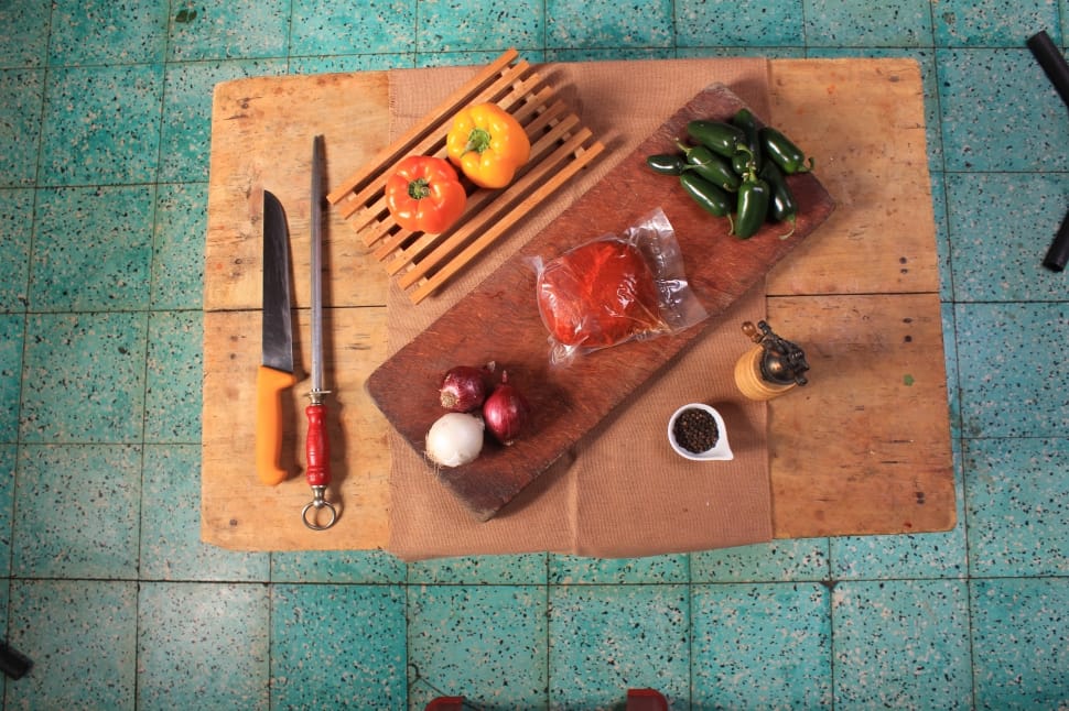 brown wooden cutting board and bell peppers preview