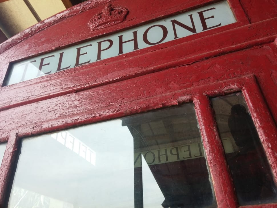 red wooden telephone booth preview