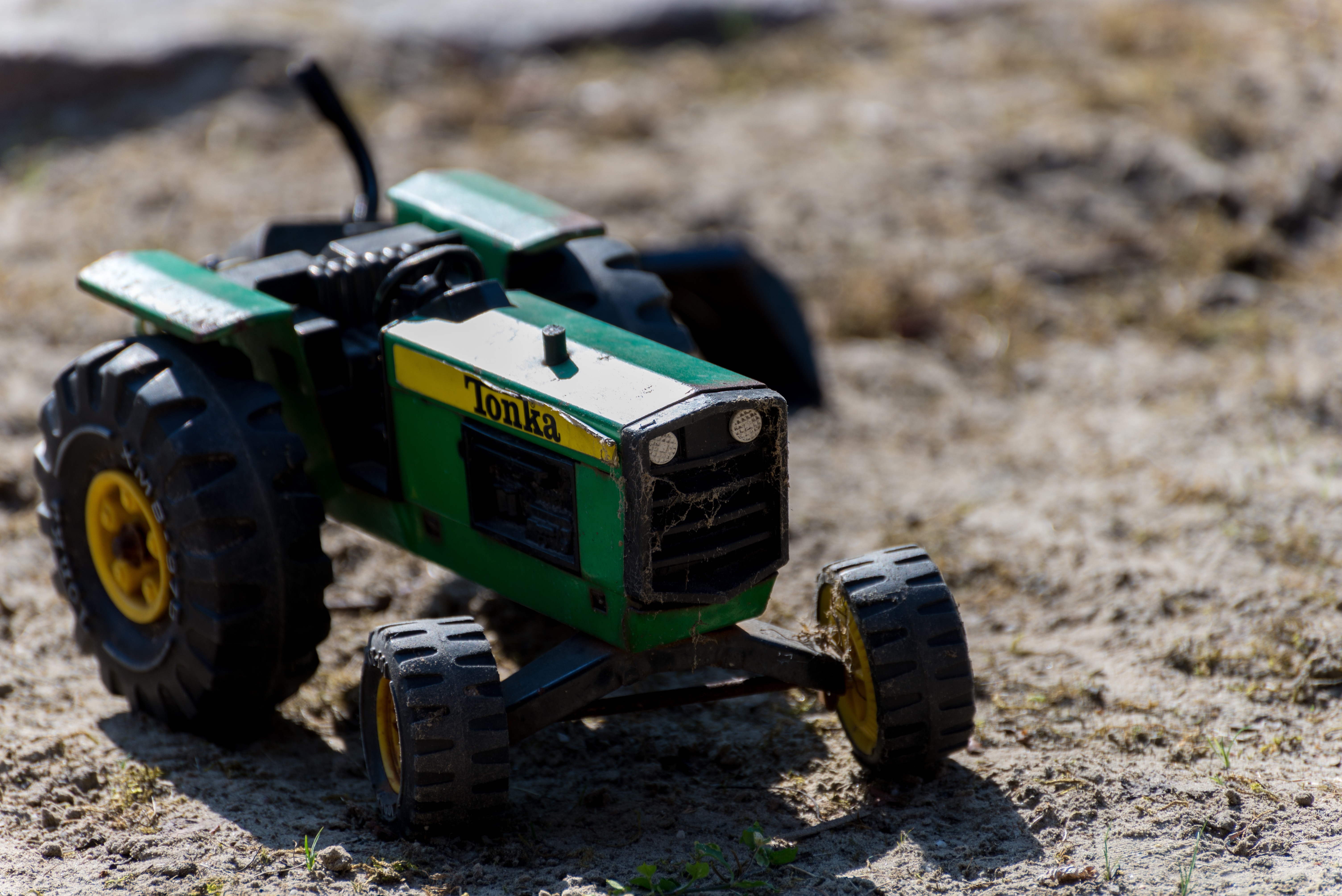 green yellow and white tractor scale model