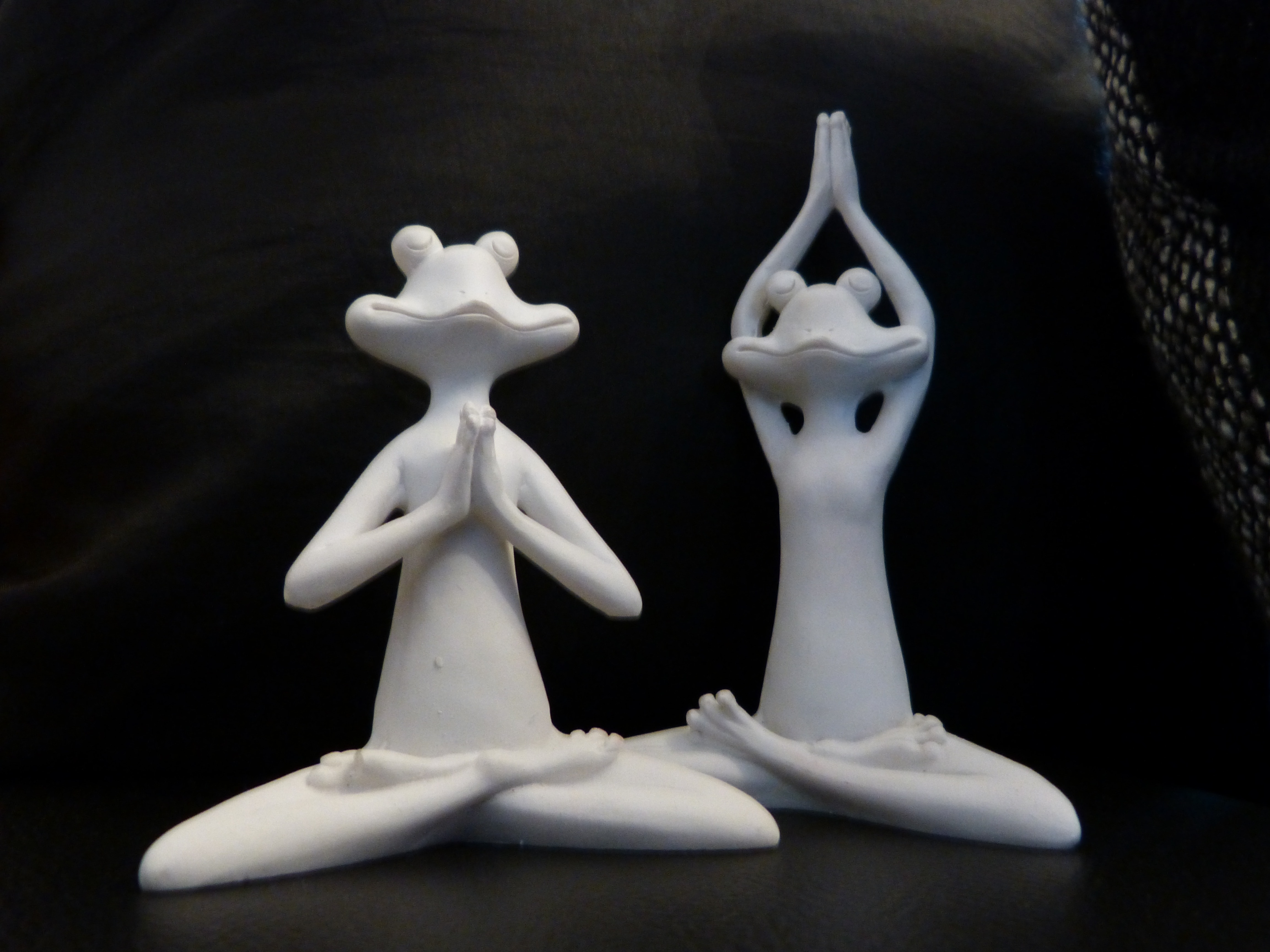 two white ceramic frog table decor