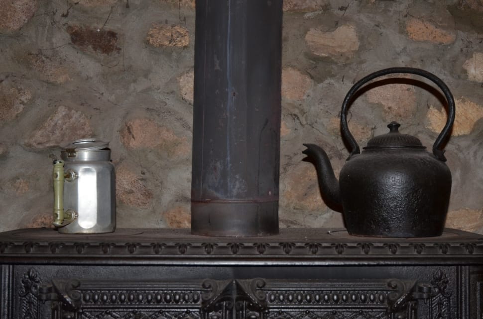 black cooking furnace,teapot and steel mug preview