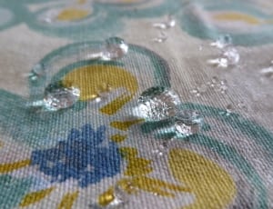 water drop on yellow and blue floral textile thumbnail