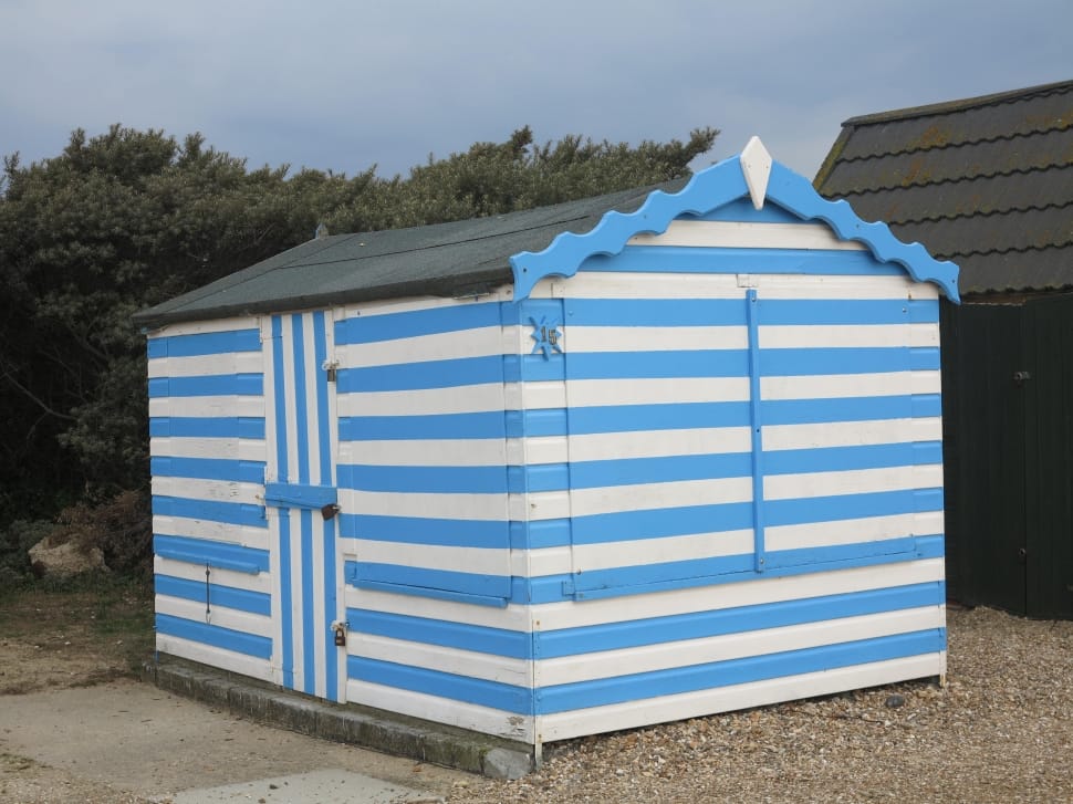 white and blue wooden shed preview