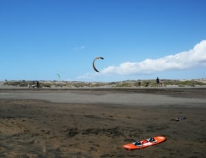 orange and green wake board and kite surfing thumbnail