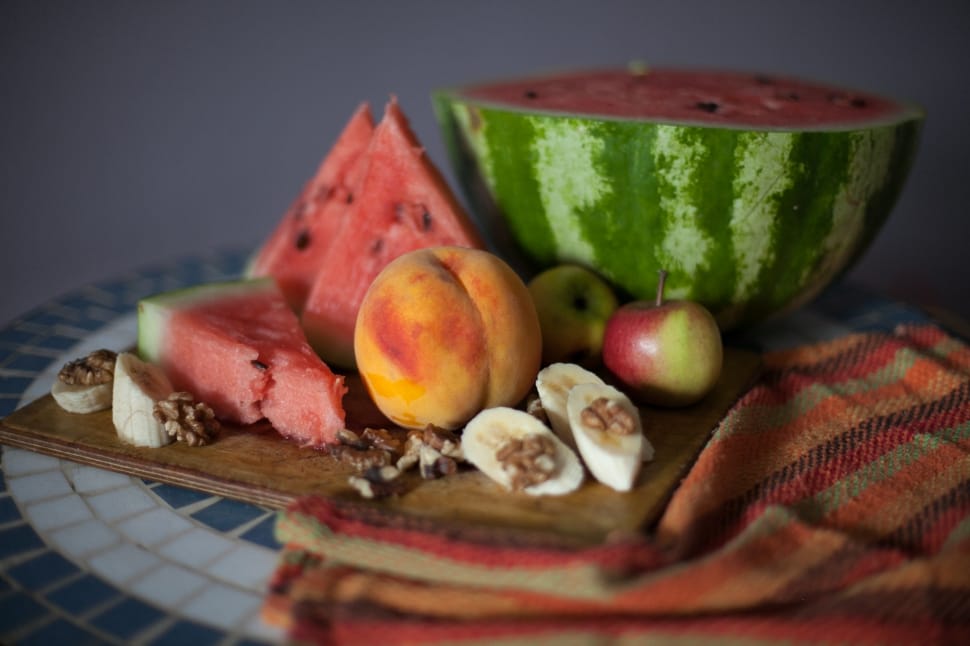 four variety of fruits on brown chopping board preview
