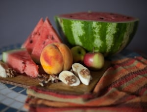four variety of fruits on brown chopping board thumbnail