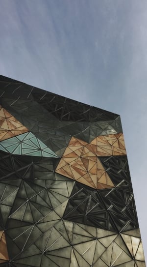 low angle photography of black, brown, and blue cubism building thumbnail