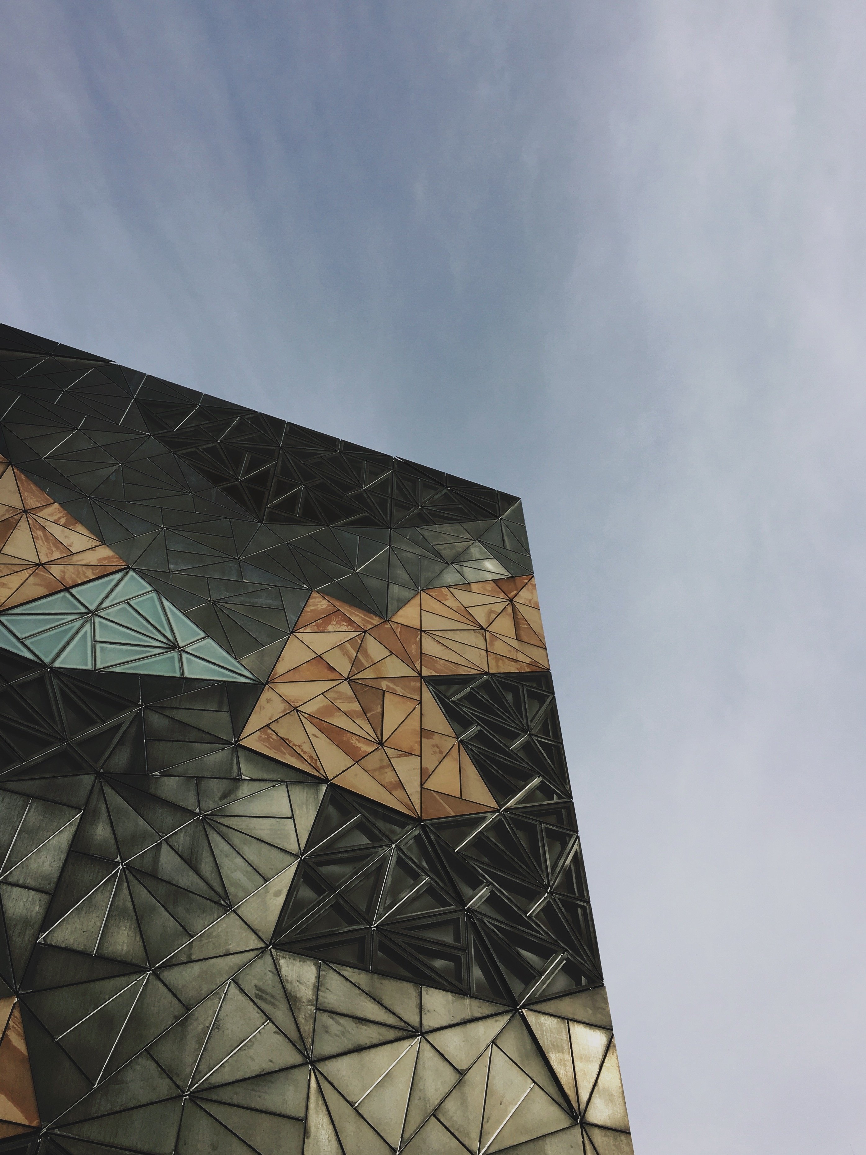low angle photography of black, brown, and blue cubism building