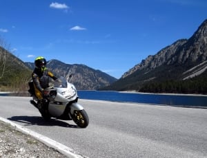 men's yellow and black racing suit and sports motorcycle thumbnail