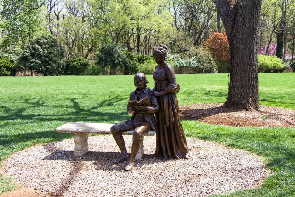 brown couple statue on bench preview