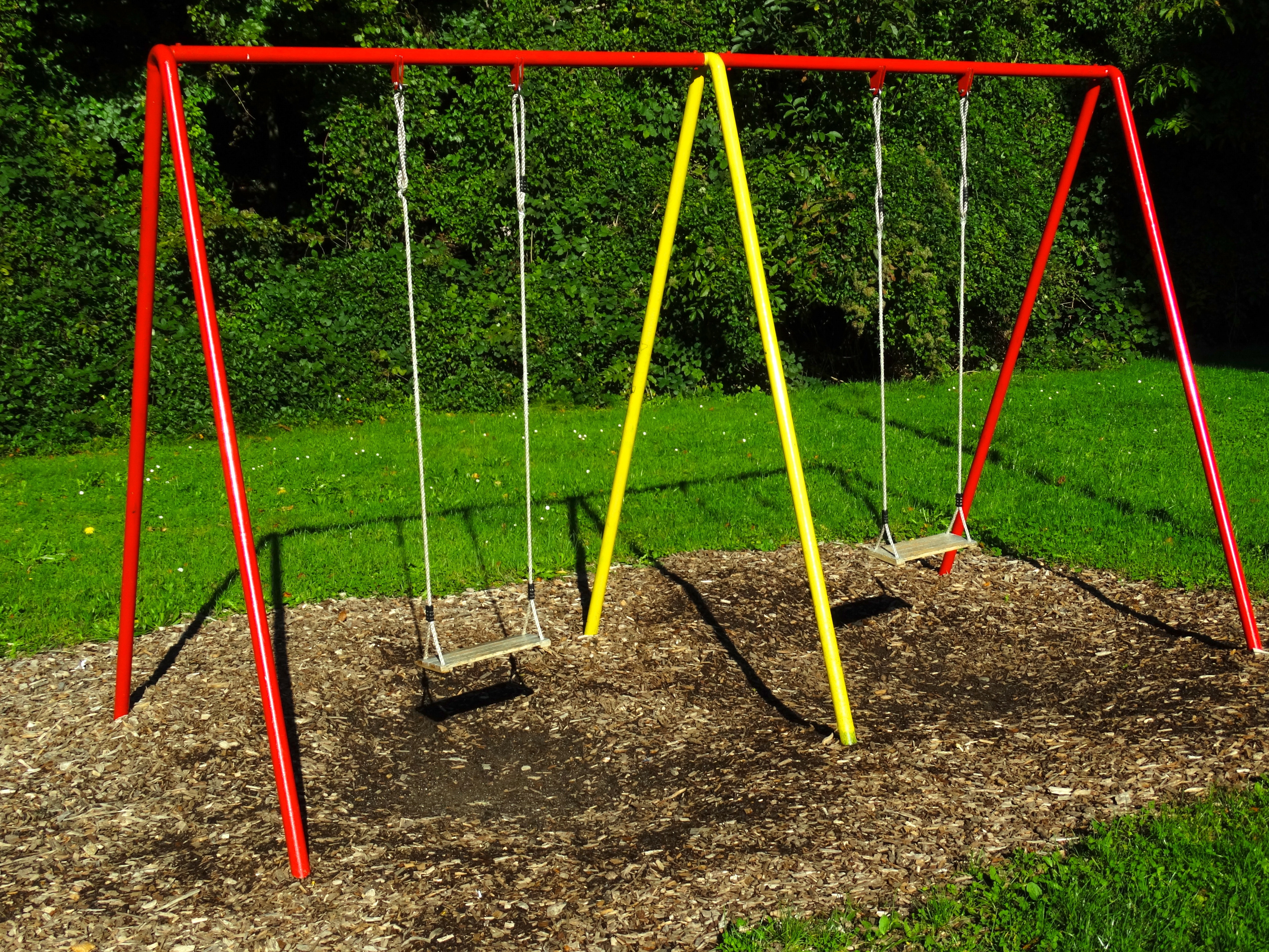 "yellow and red swing playground" image online crop.