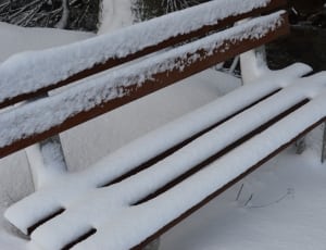 snow covered wooden bench thumbnail