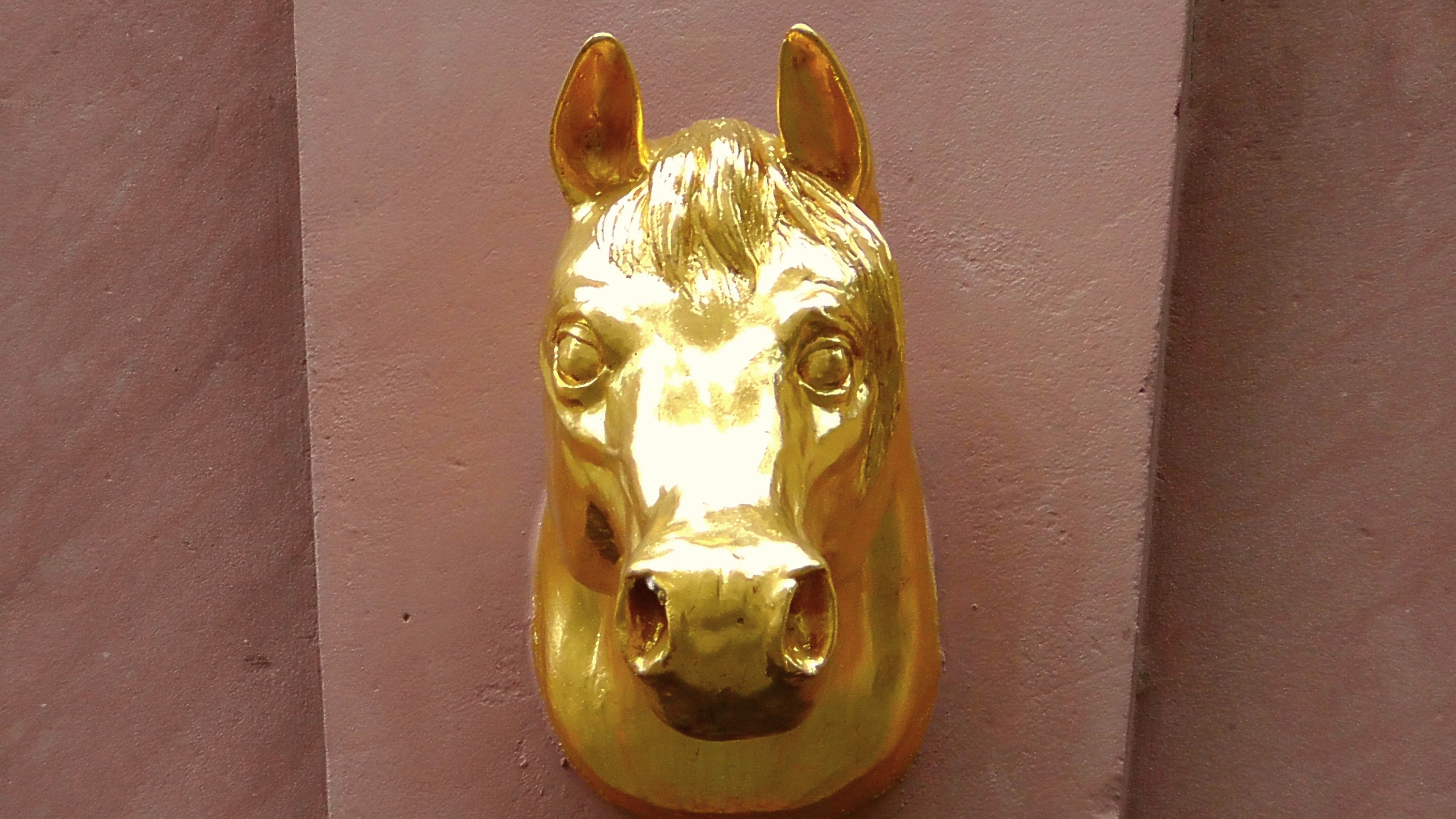 gold horse head figurine