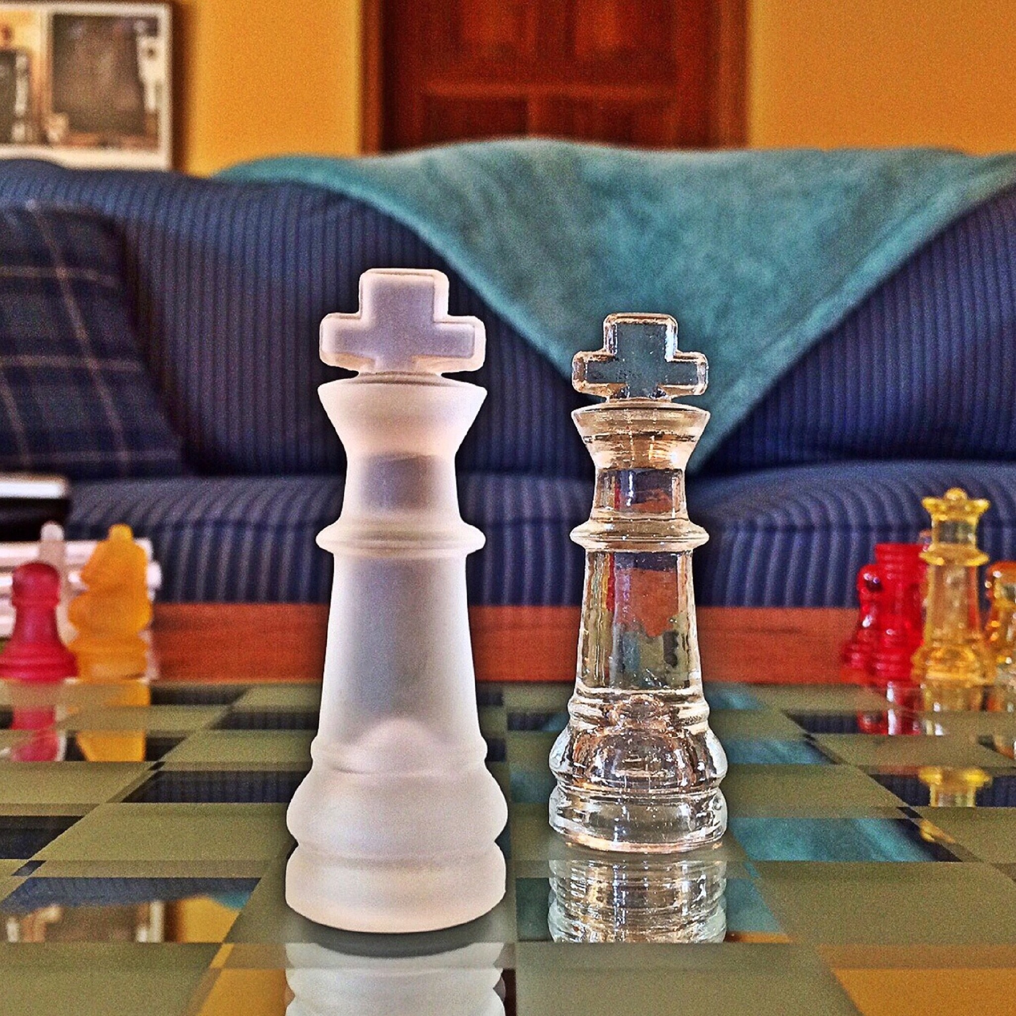 2 glass king chess pieces