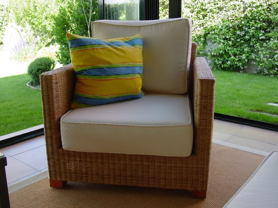 brown wicker frame white padded armchair preview