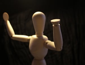 white wooden figurine thumbnail