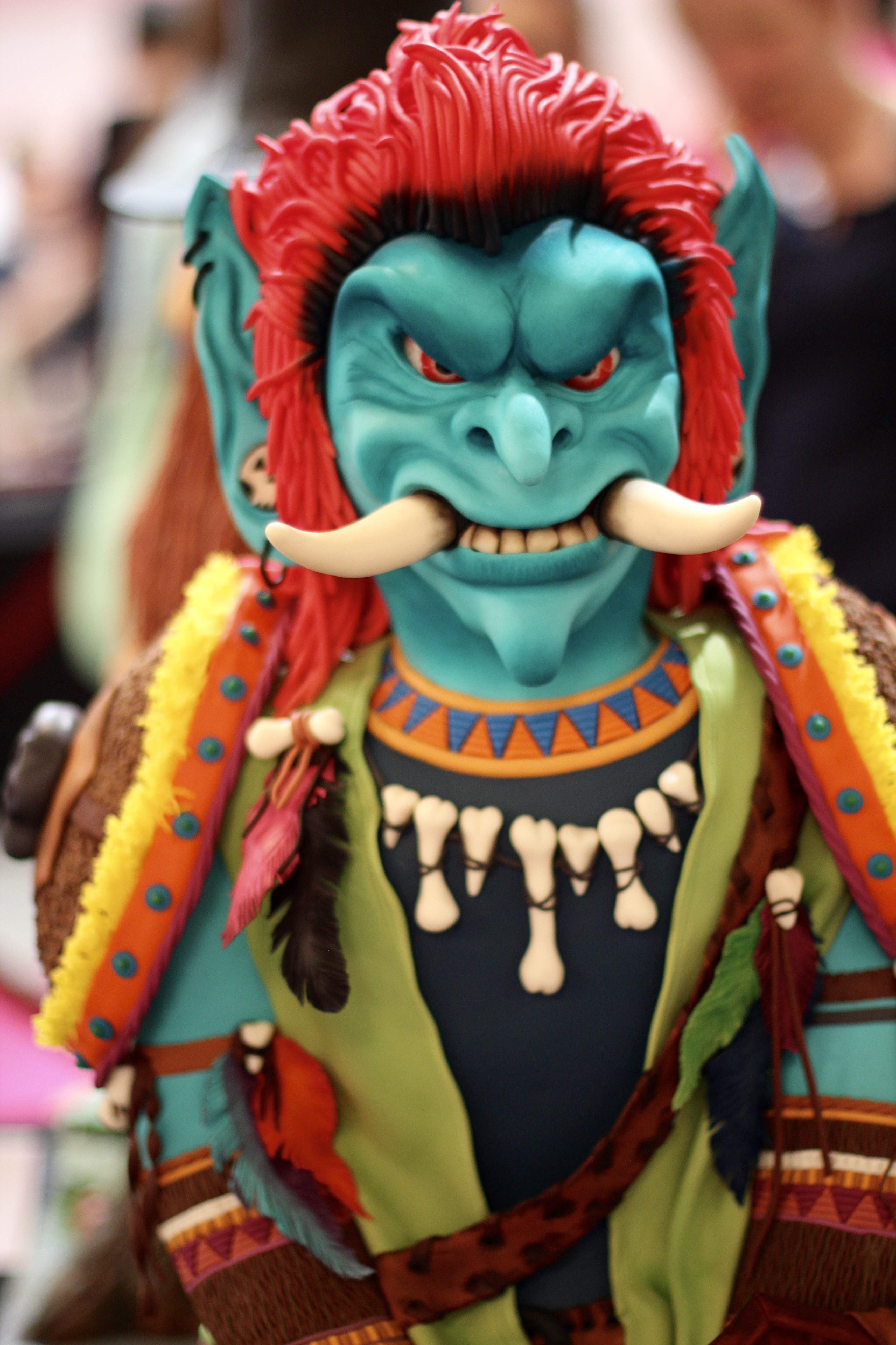 blue and red oni figurine