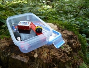 red box and blue and black tubular handled tool and plastic case thumbnail