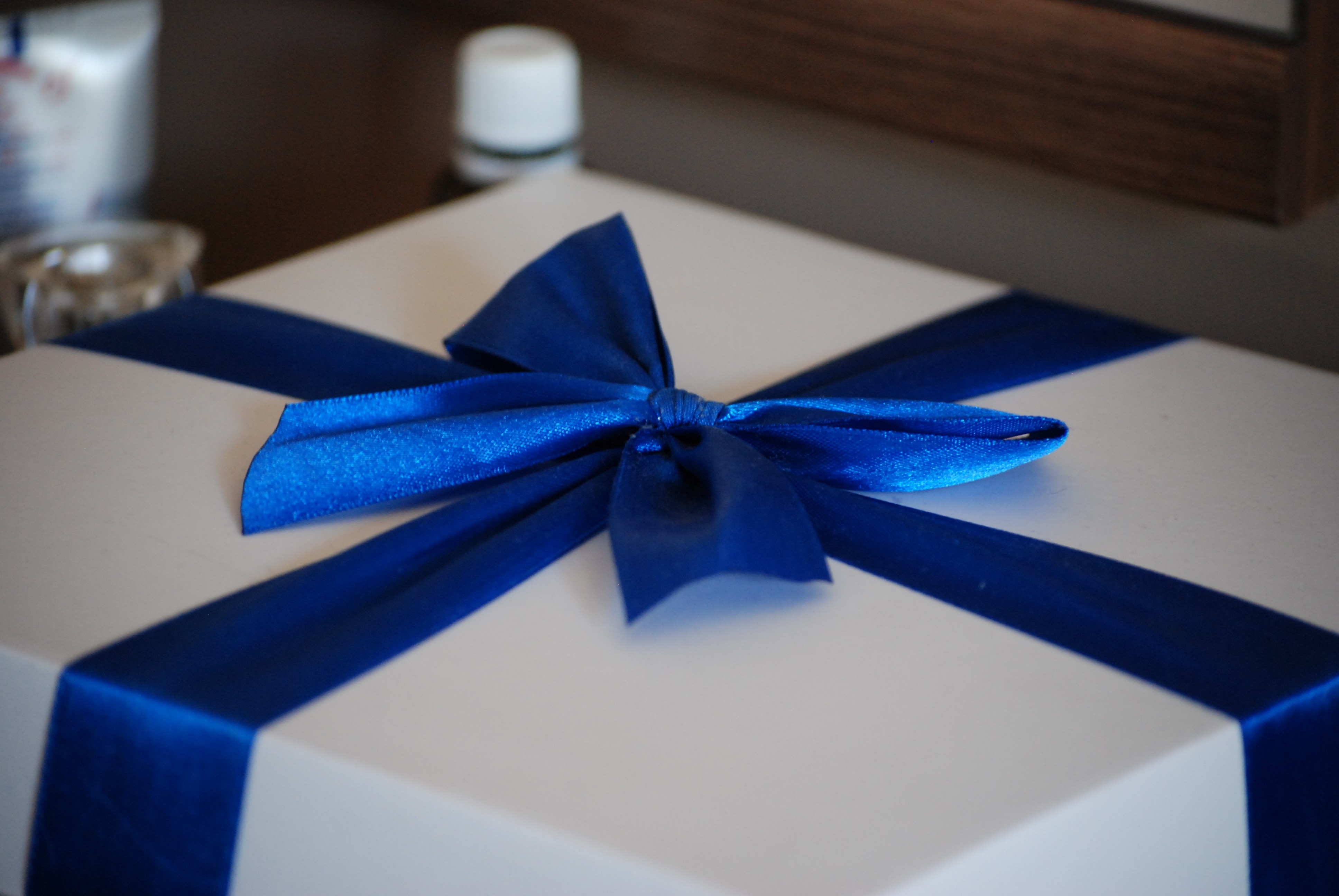 white and blue ribbon gift box