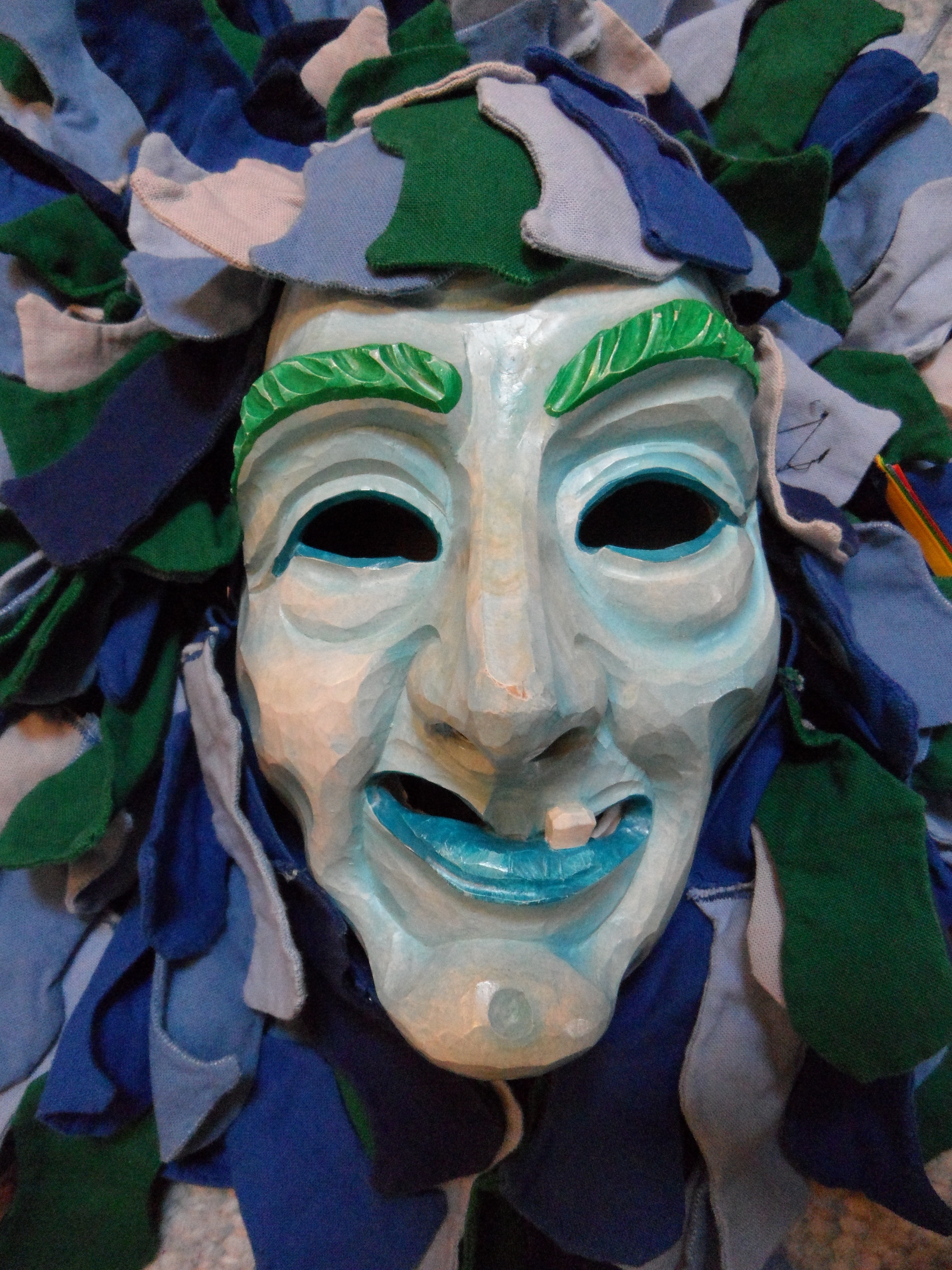 white blue and green mask
