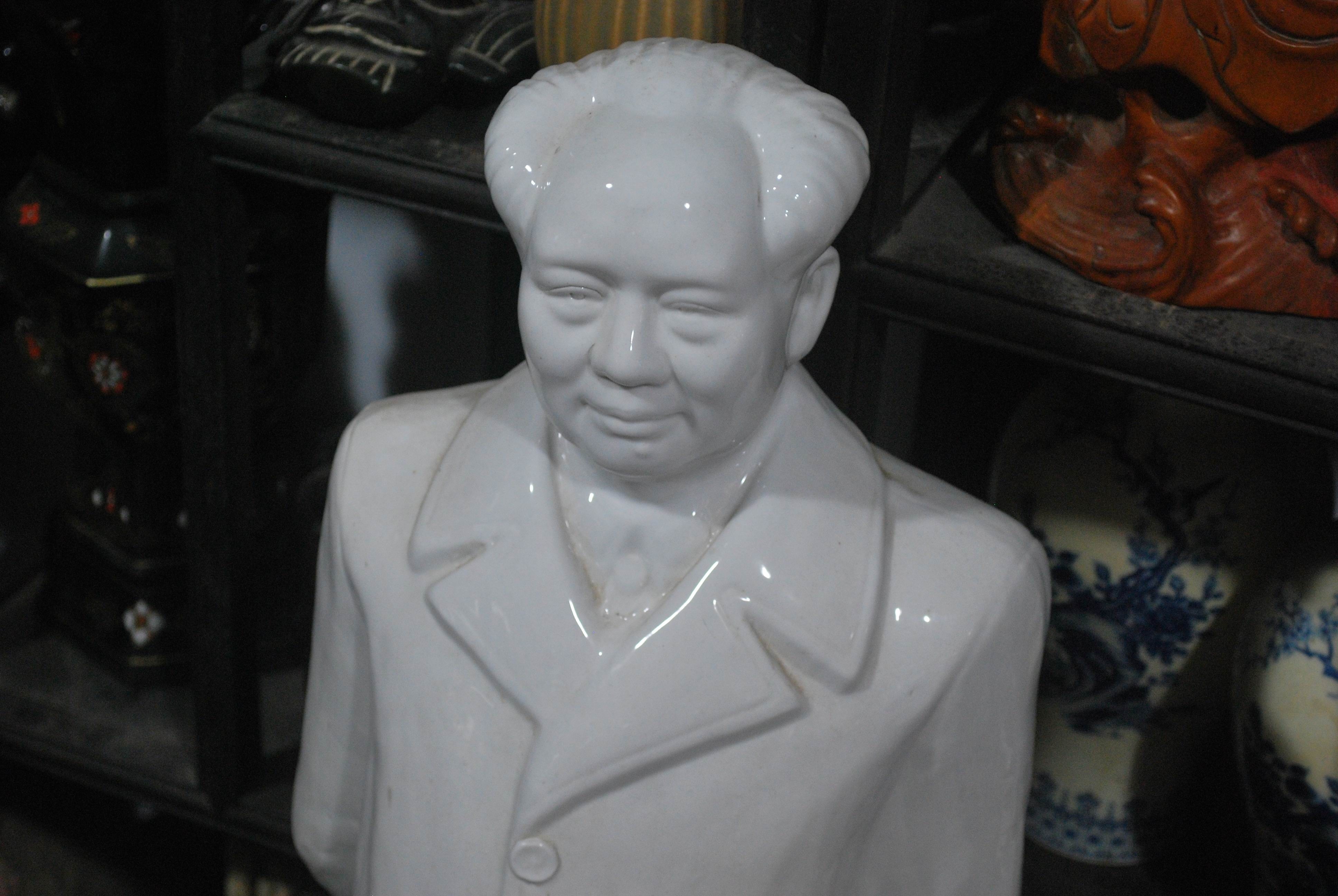 white ceramic bust statue
