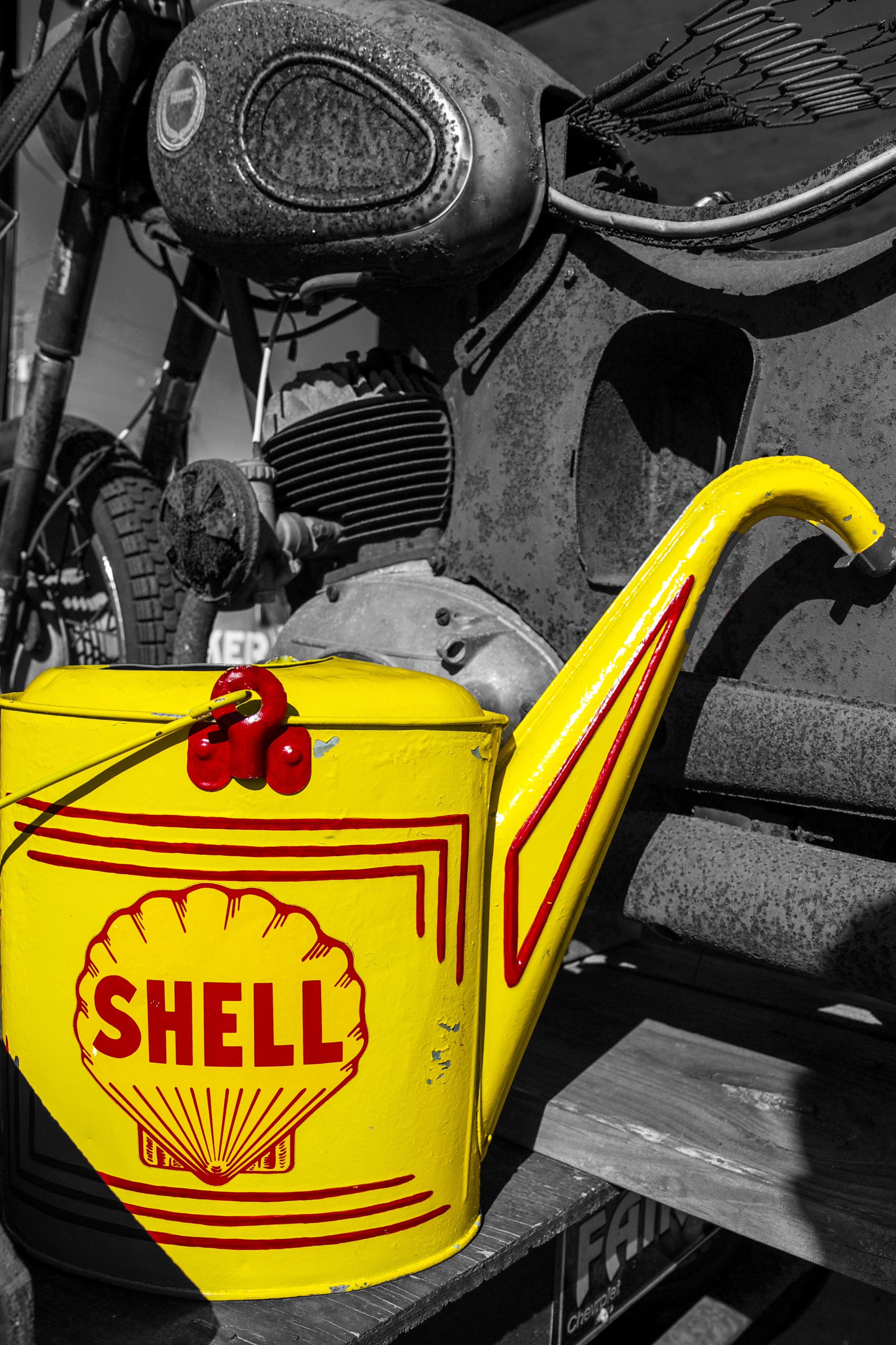 yellow and red shell print watering can