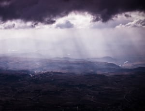 photography of light emitting through clouds thumbnail