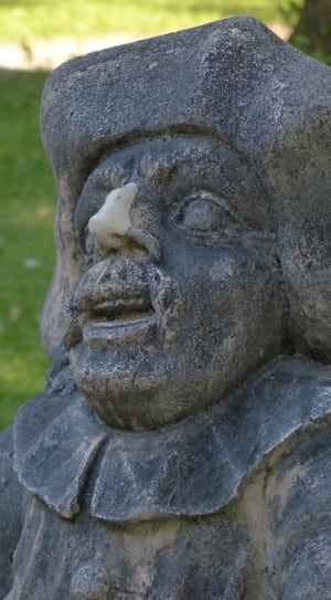 man black concrete statue during daytime thumbnail