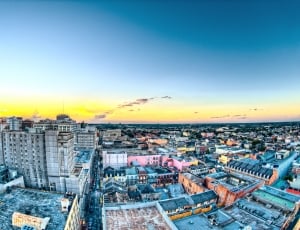 aerial view and fish eye photography of high rise city buildings at golden hour thumbnail