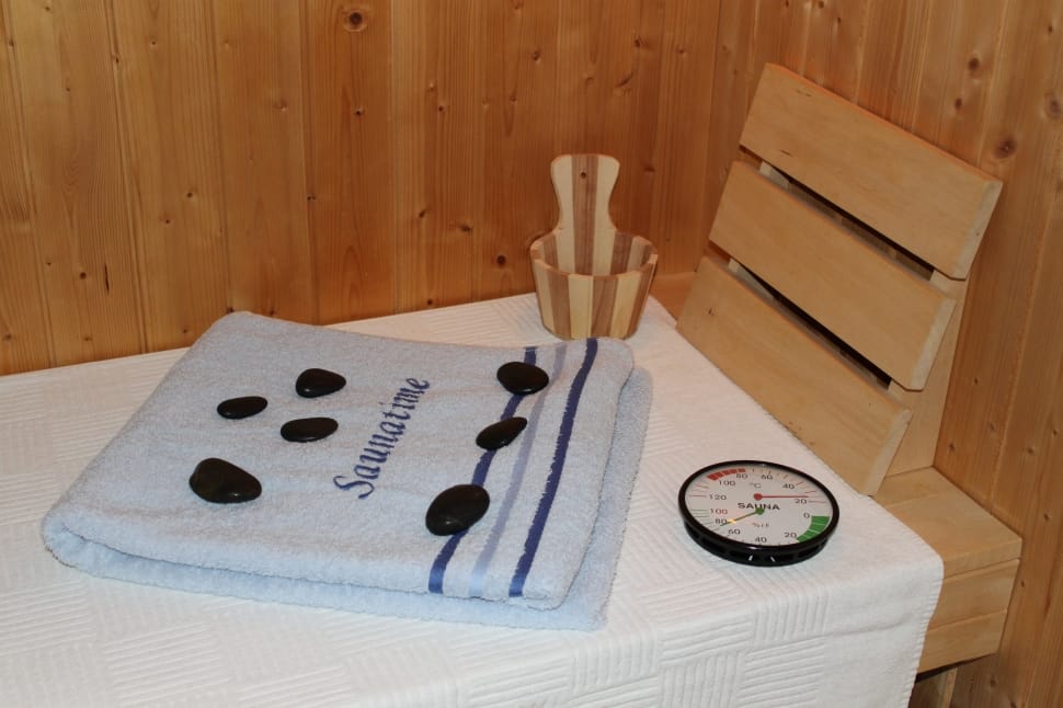 black pebbles stones gauge meter and blue bathroom towel preview